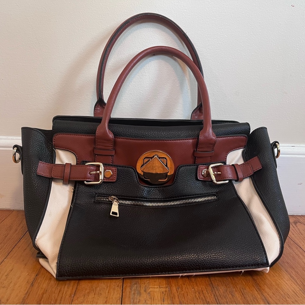 Top handle large purse. Leather tote. Top flap closure, adjustable width.